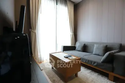 Cozy living room with modern sofa and natural light from large window