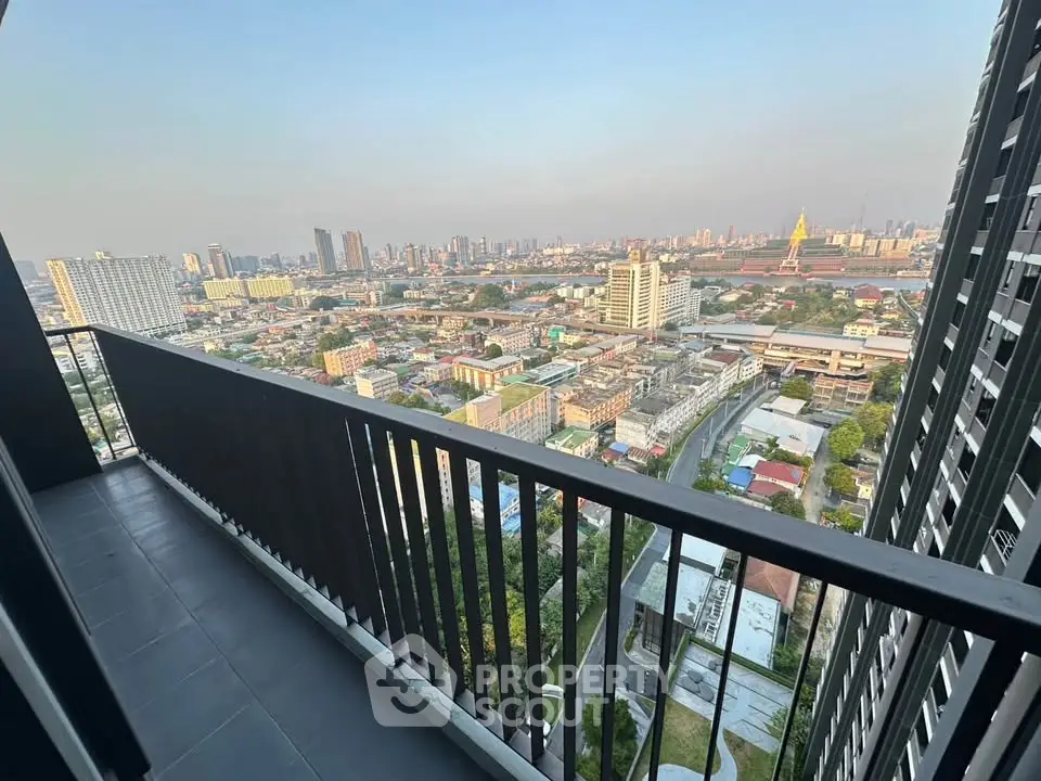 Stunning high-rise balcony view of city skyline and urban landscape.