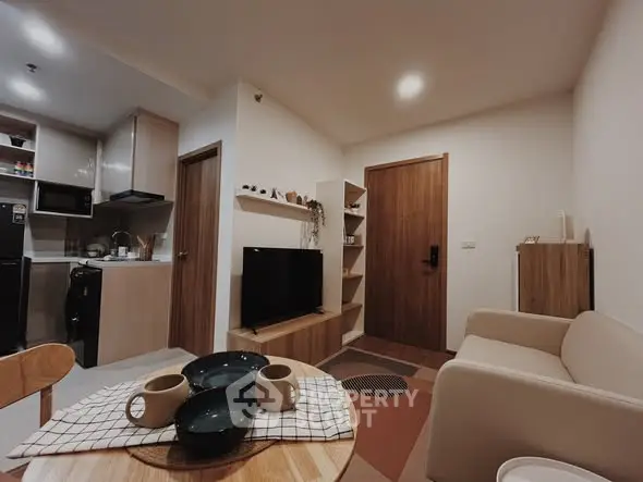 Cozy modern living room with open kitchen and stylish decor