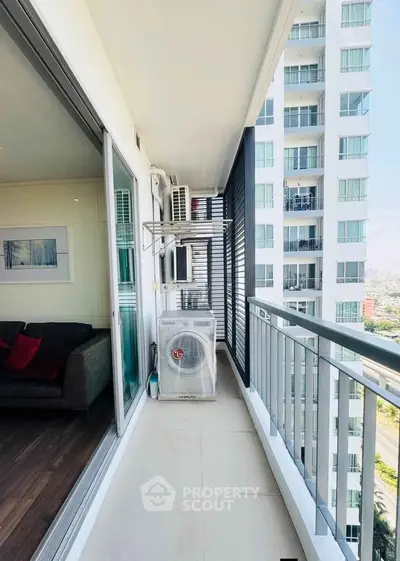 Modern apartment balcony with city view and air conditioning unit