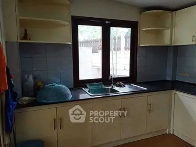 Cozy kitchen with natural light and ample storage space