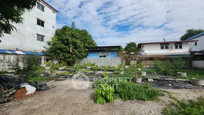 Spacious urban garden plot with potential for development in residential area.