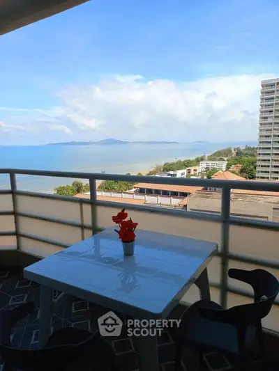 Stunning ocean view from a high-rise balcony with modern seating