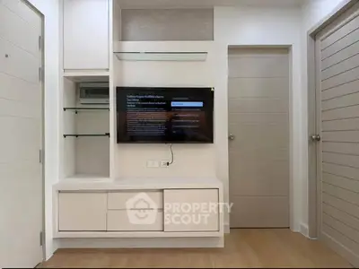 Modern living room with sleek built-in TV unit and minimalist design