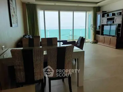 Spacious beachfront living room with stunning ocean view and modern decor.
