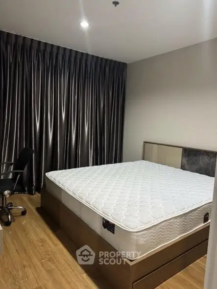 Spacious bedroom with modern decor and comfortable mattress