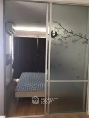 Cozy bedroom with sliding glass door and elegant decor