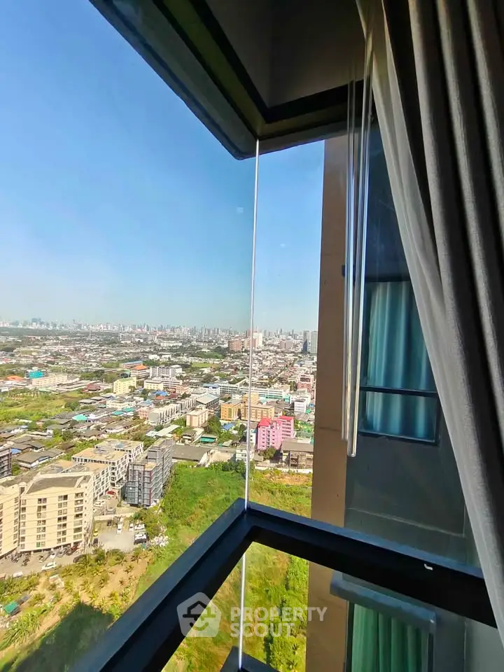 Stunning corner unit with panoramic city view from high-rise building window.