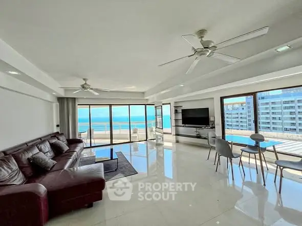 Spacious living room with ocean view and modern furnishings