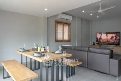 Modern living room with stylish dining area and cozy seating, perfect for entertaining.