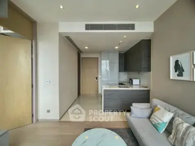 Modern living room with open kitchen and stylish decor