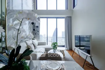 Luxurious high-rise living room with stunning city view and elegant decor