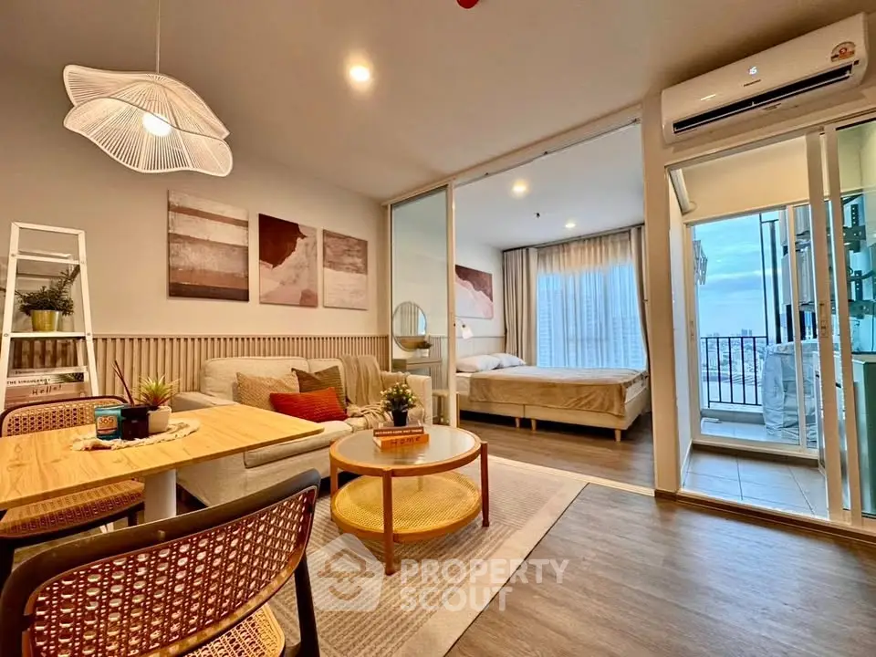 Modern open-plan living room with stylish decor and balcony view