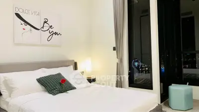 Luxurious bedroom with city view, modern decor, and elegant lighting for a serene living experience.