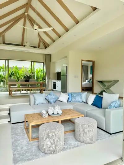 Luxurious open-plan living room with high ceilings and modern decor