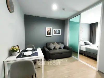 Modern living room with cozy sofa and dining area in stylish apartment