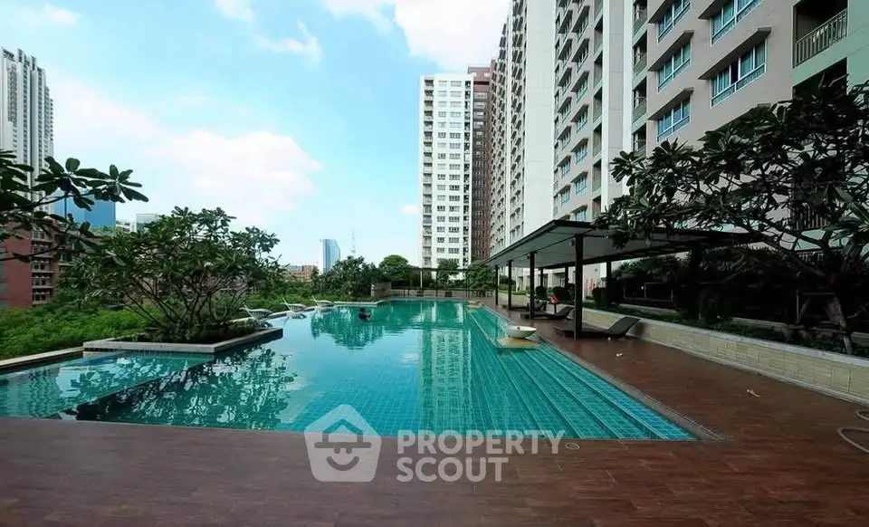 Luxurious high-rise apartment with stunning pool and city views, perfect for urban living.