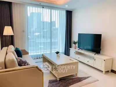 Bright and modern living room with large window and stylish decor