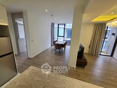Modern open-plan living and dining area with stylish decor and natural light.