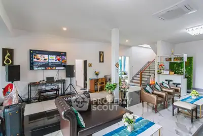 Spacious modern living room with elegant decor and entertainment setup