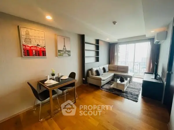 Modern living room with wooden flooring and stylish decor in a high-rise apartment.