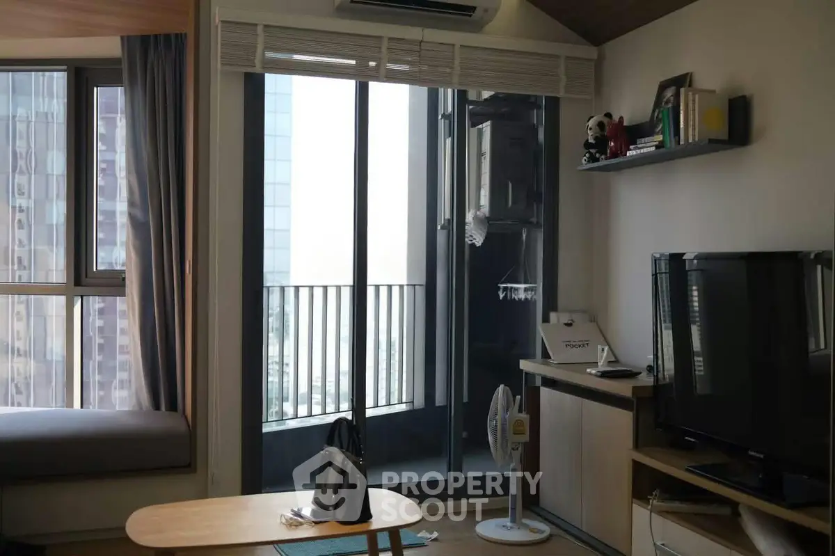 Modern living room with balcony view in high-rise apartment
