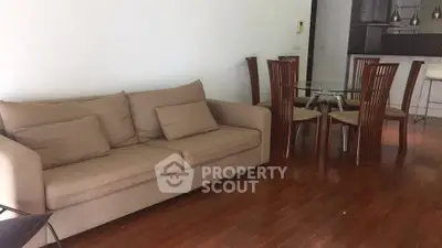 Spacious living room with modern furniture and wooden flooring