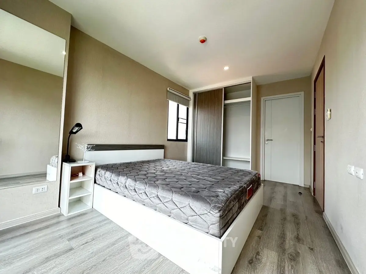 Modern bedroom with sleek design and ample natural light