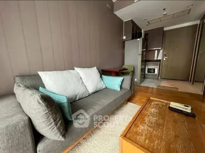 Modern living room with cozy sofa and stylish decor in a contemporary apartment.