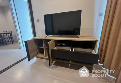 Modern living room with sleek TV stand and open storage drawers