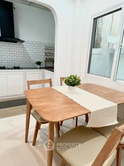 Charming kitchen with modern dining set and open layout