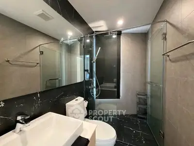 Modern bathroom with sleek design and glass shower enclosure