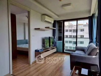 Modern living room with balcony view and stylish furniture