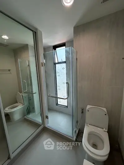 Modern bathroom with glass shower and sleek design