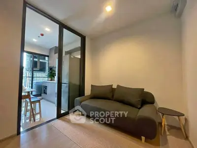 Modern living room with sleek design and open kitchen layout