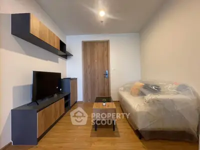 Modern living room with sleek furniture and wooden flooring