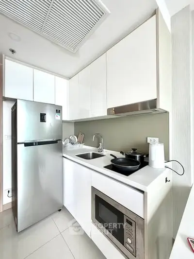 Modern kitchen with sleek appliances and minimalist design