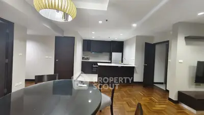 Spacious modern living room with open kitchen and elegant wooden flooring