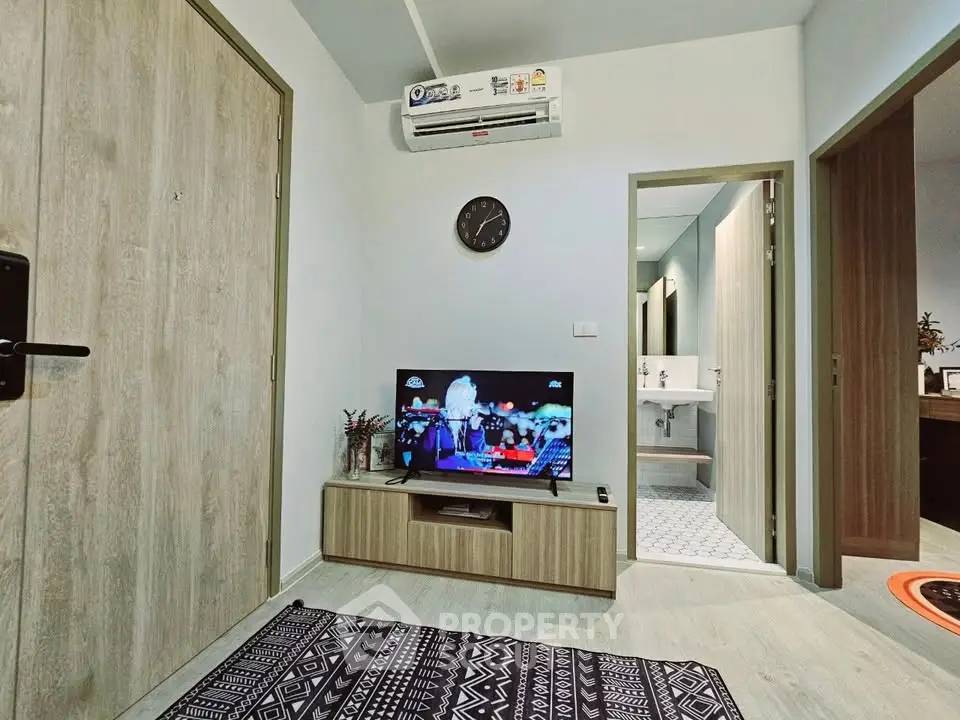 Cozy living room with modern decor and wall-mounted air conditioning