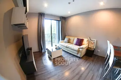 Modern living room with cozy sofa and balcony view in stylish apartment