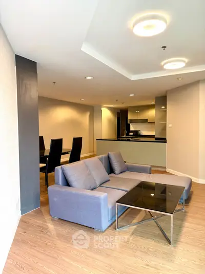 Spacious modern living room with open kitchen and stylish furnishings