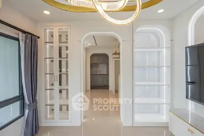 Luxurious modern living room with elegant lighting and built-in shelving