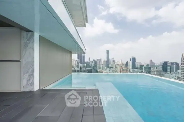 Luxurious rooftop infinity pool with stunning city skyline view