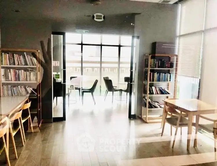 Spacious library area with modern furniture and ample natural light