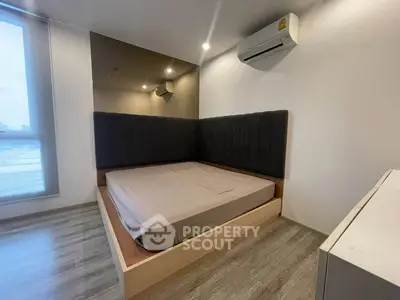 Modern bedroom with sleek design and air conditioning in urban apartment