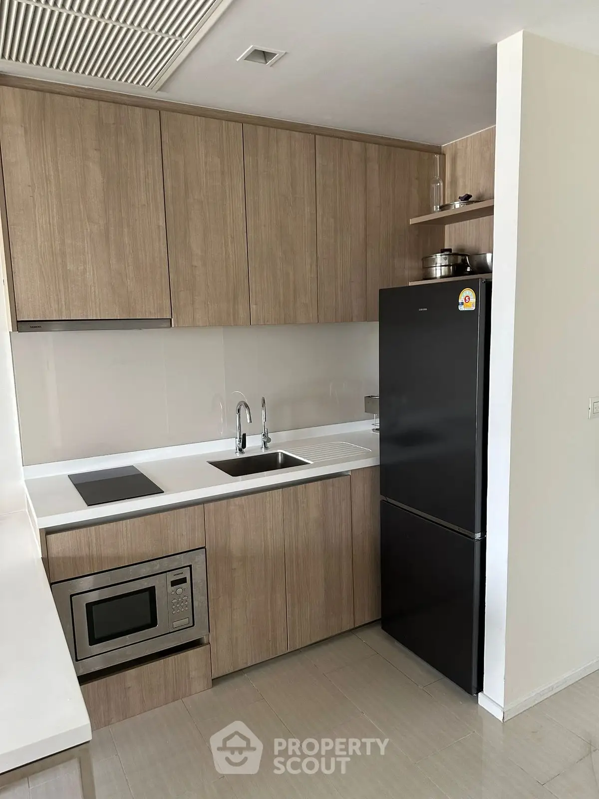 Modern kitchen with sleek cabinetry, built-in appliances, and elegant design