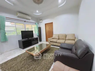 Spacious living room with modern furniture and natural light