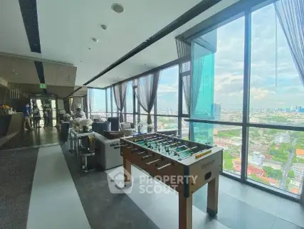 Luxurious high-rise building with panoramic city views and recreational area.