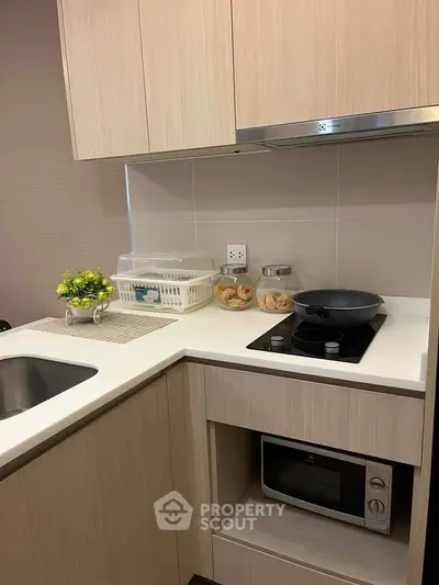 Modern kitchen with sleek cabinetry and built-in appliances, perfect for urban living.