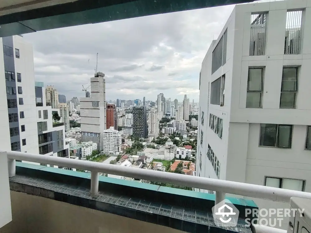 Stunning cityscape view from high-rise balcony in urban setting